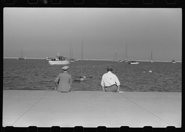 Photo:1930s Men Seated by Harbor Sailboats Waterfront Scene
