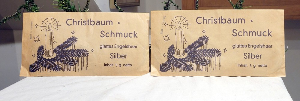Two Packages of Christbaum Schmuck. Silver Tinsel. 