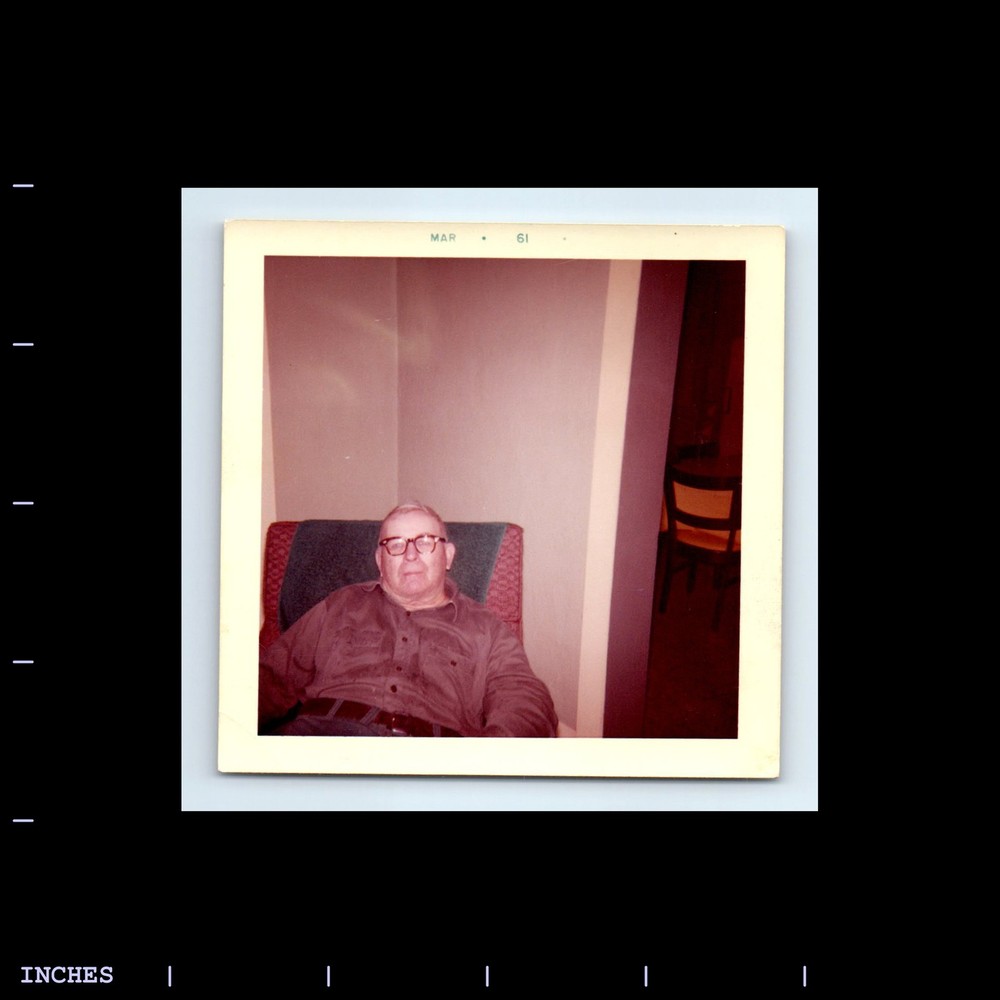 Square Color Photo MAN SITTING IN CHAIR WITH GLASSES 1961