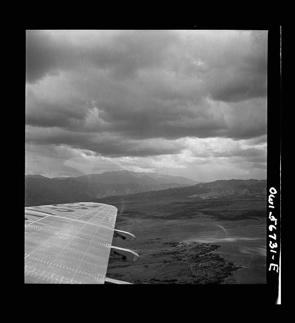 Photo:1930s Airplane Wing Over Mountain Landscape Aerial View