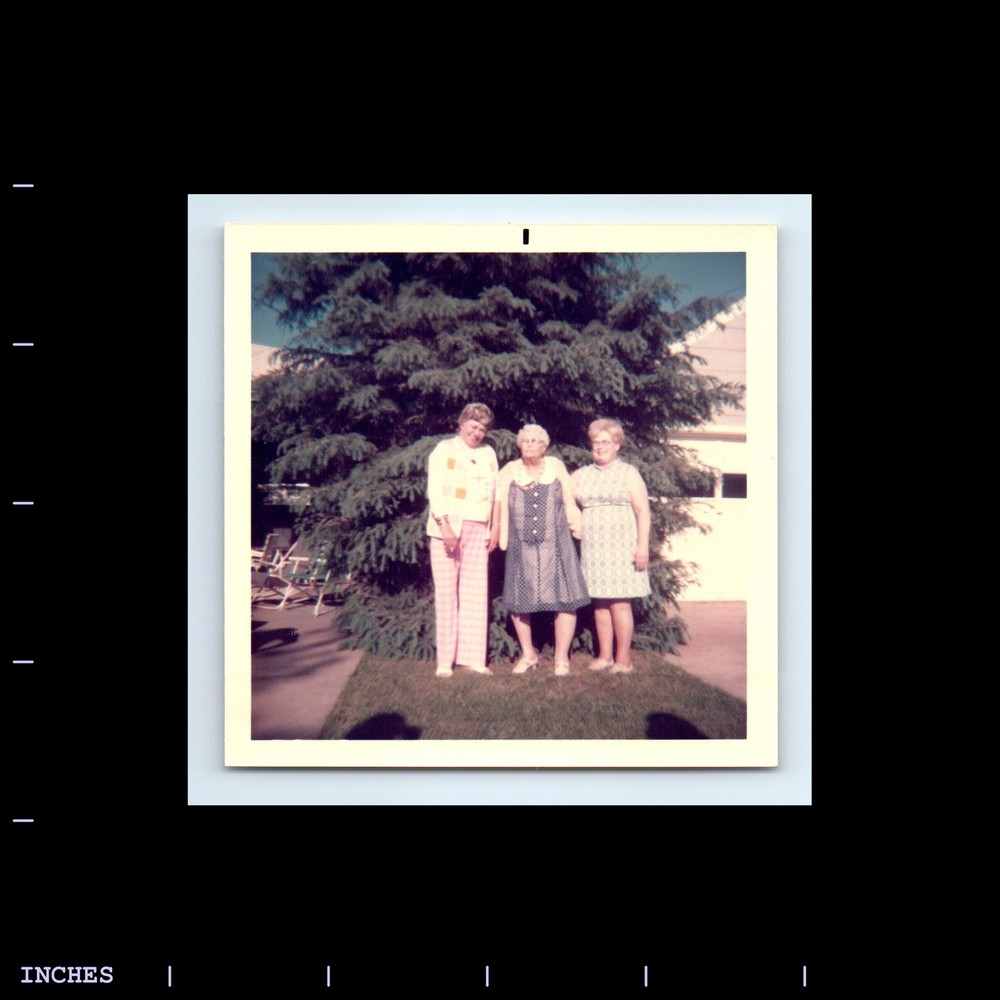 Square Color Photo WOMEN STANDING OUTSIDE THREE GRACES