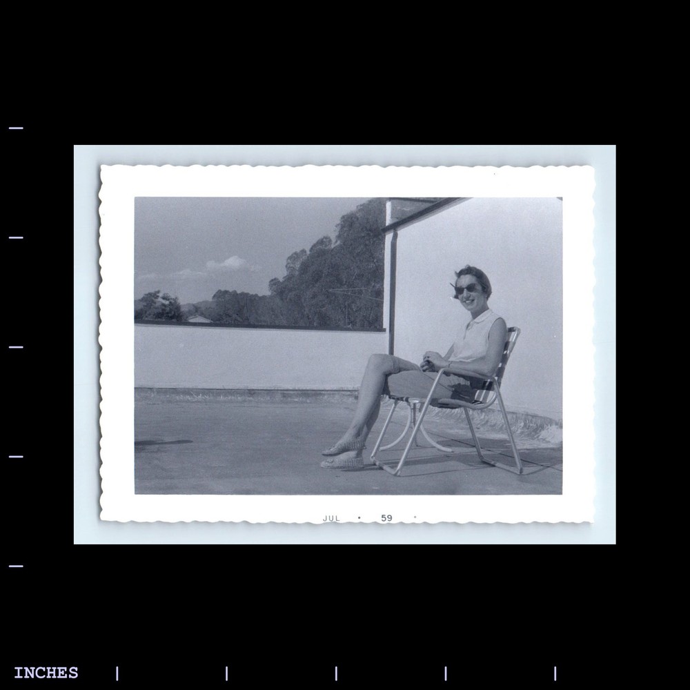Old Vintage Photo LEGGY WOMAN SITTING IN CHAIR 1959