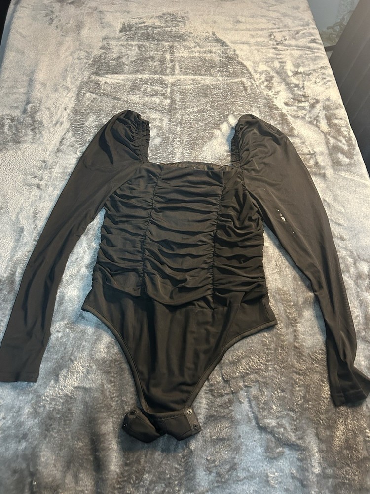 Bebe off the shoulder, feminine body suit.Size L