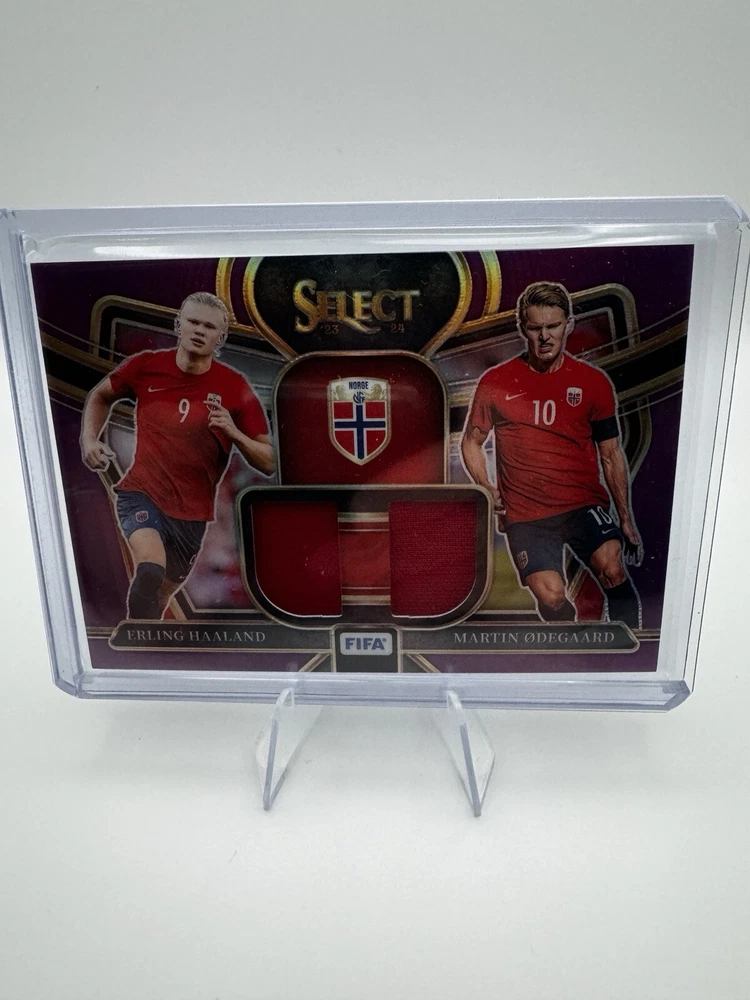 2023-24 Panini Select FIFA - Dual Swatches Purple Prizm #DS-NOR Erling Haaland, Martin Odegaard /49 (MEM)