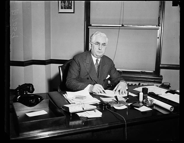 Photo:Man Office Portrait 1930s Desk Telephone Papers