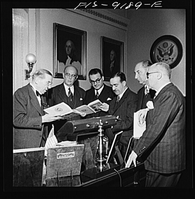 Photo:Washington DC 1930s Men Reading at Desk with U.S. Seal Portraits