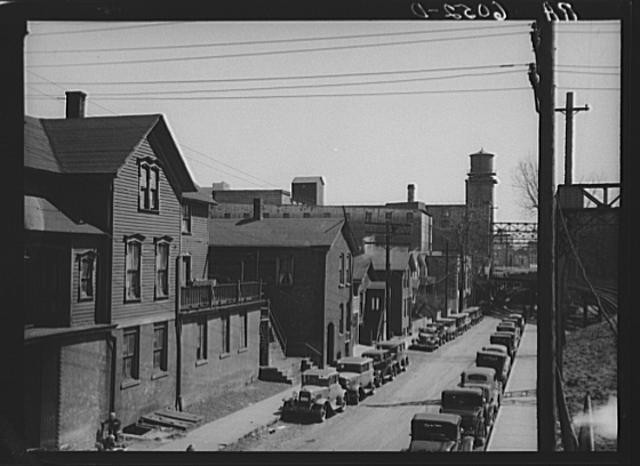 Residential houses crowded in industrial district. Milwaukee, Wisconsin