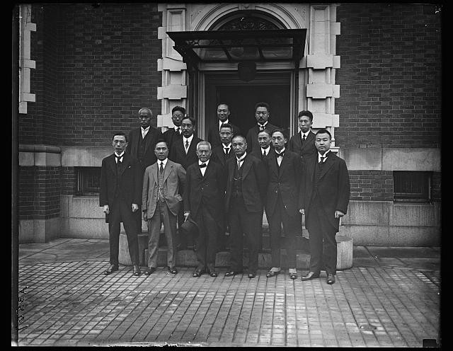 Photo:Group Portrait Japanese Men in Suits 1910s Brick Building Entrance