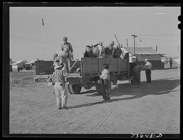Photo:1930s Migrant Farm Workers on Truck Camp Scene