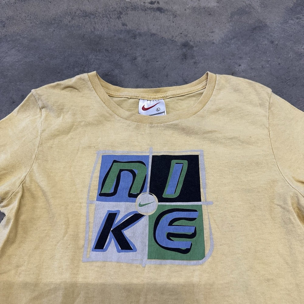 Vintage 90s Nike Kids Yellow Graphic T-Shirt Size Large (14) USA Made