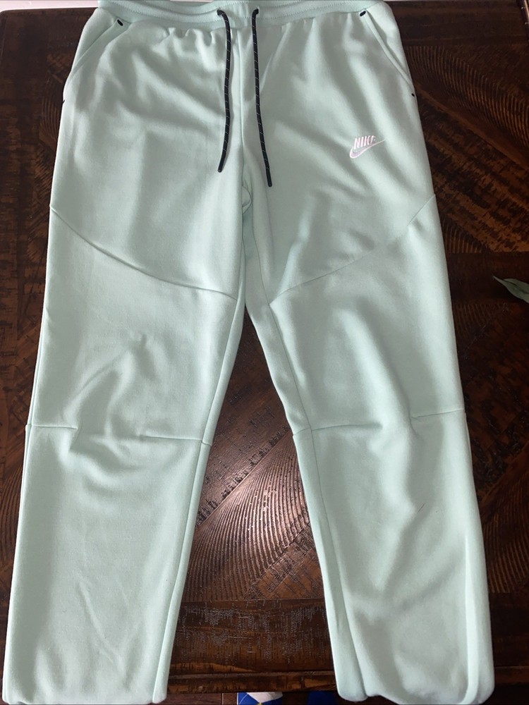 nike tech turquoise pants large