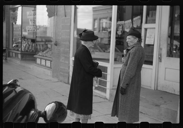Photo:1930s Women Standing on Sidewalk Storefront Street Scene