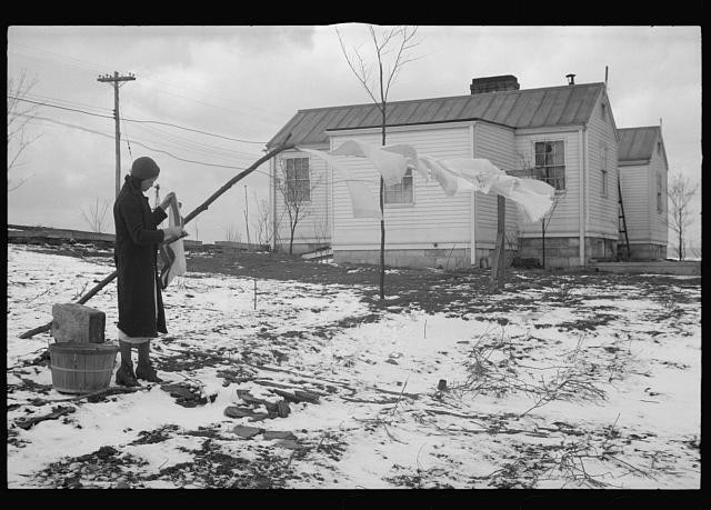 Photo:1930s Rural Woman Hanging Laundry Snow House
