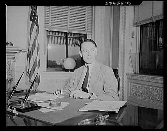 Photo:Unidentified Man at Desk Office 1930s American Flag Window Portrait