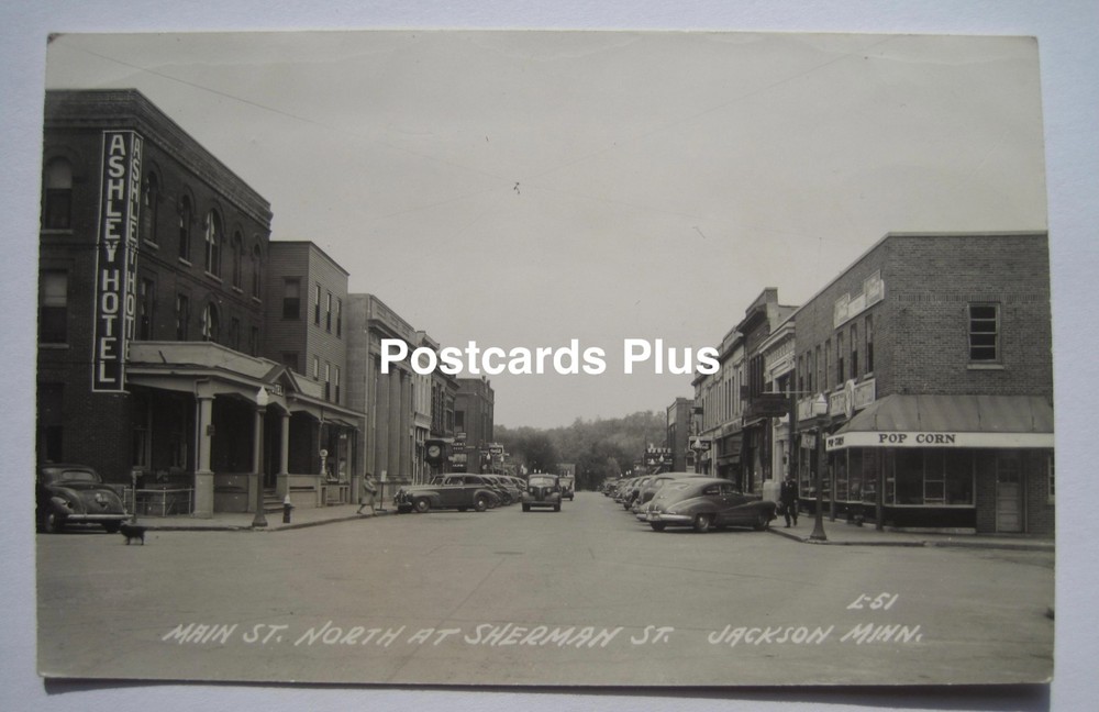 Jackson MN Main Street North at Sherman Old 1940s RPPC Postcard; Pop Corn Sign +
