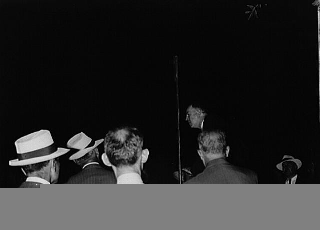 Photo:Crowd at Night 1950s Men in Hats Outdoor Speech