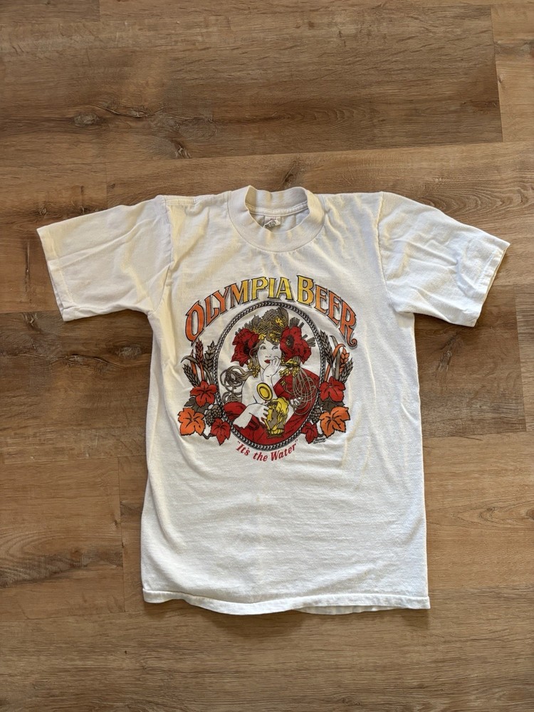 Vtg 1970s Olympia Beer It’s The Water Shirt Size Small All Cotton USA Hippy
