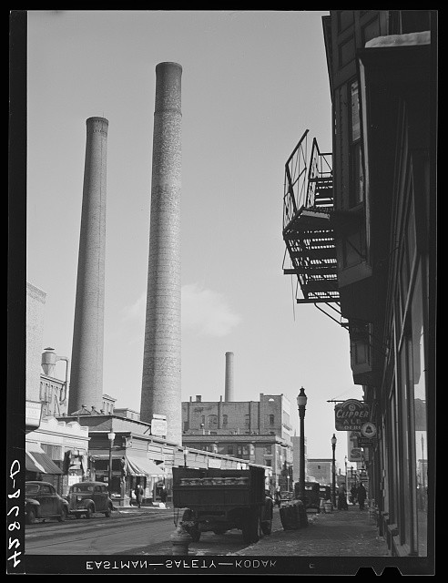 Photo:Lowell Massachusetts 1941 street smokestacks downtown trucks