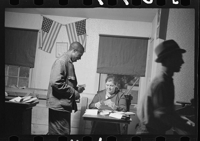 Photo:1930s Office Scene American Flags Man Woman Desk Silhouette