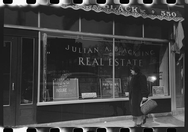 Photo:Front of real estate office in Negro section of Chicago, Illinois