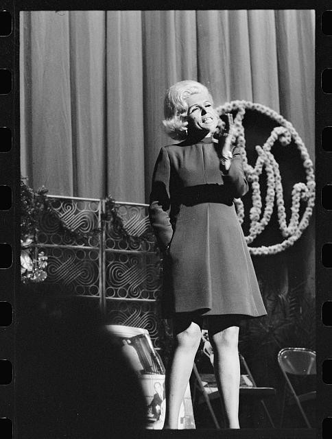 Photo:Image Watchers Weight 1960s Woman on Stage with Megaphone