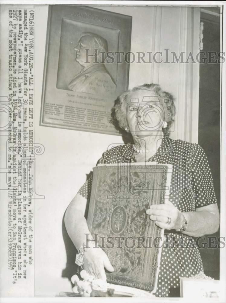 1957 Press Photo Mrs. John McGraw holds mementos from husband in New York