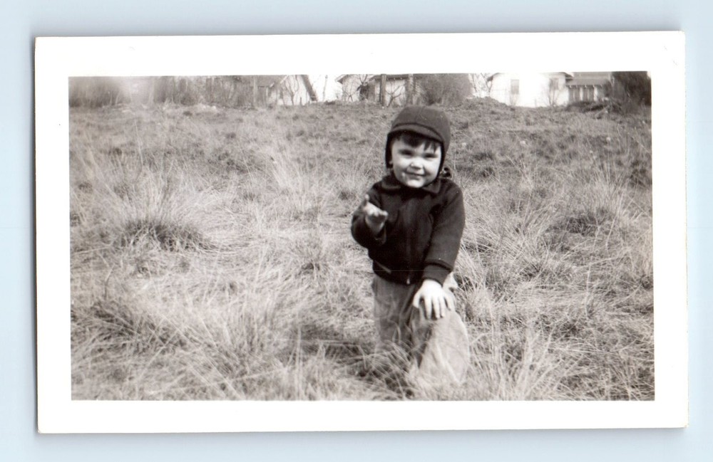 Old Vintage Photo SOLO BOY IN GRASS FIELD HOLDING OUT HAND SNAPSHOT