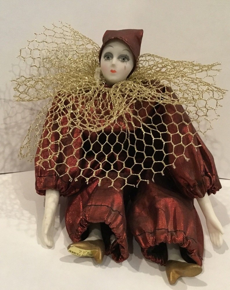 Vintage porcelain clown in red outfit with gold tulle details