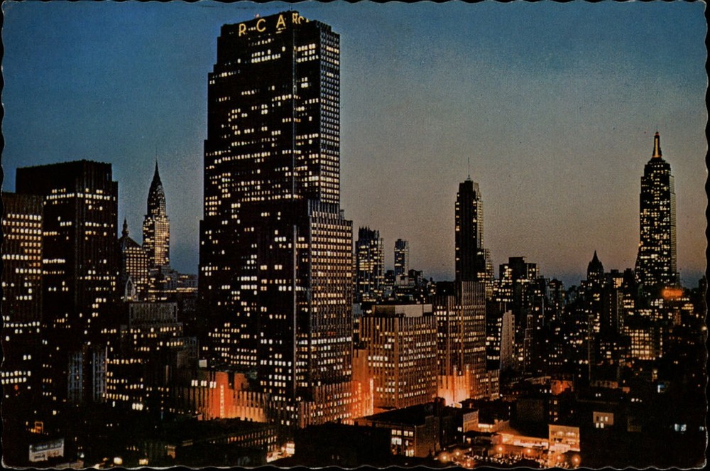 Midtown Manhattan New York City night 1970s postcard ~ Chrysler RCA Empire State