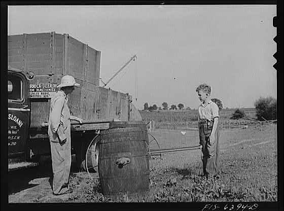 Untitled photo, : Vernon County, Wisconsin. Eddie Saugstad pouring the whey