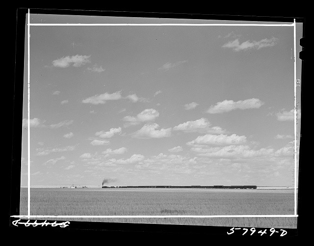Photo:Homestead Montana 1941 Freight Train Leaving Prairie Landscape