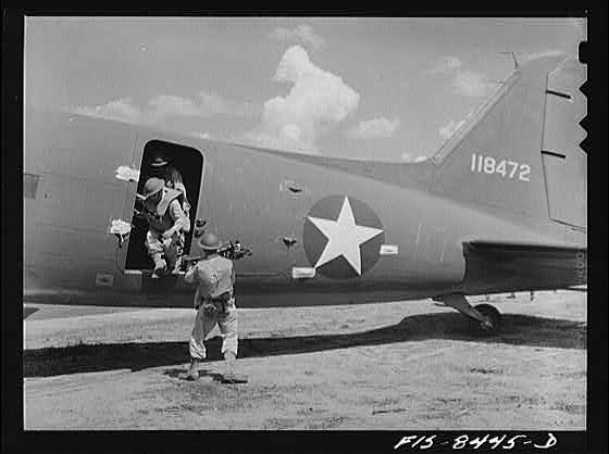 Fort Bragg, North Carolina. Airborne infantry landing from a transport plane in
