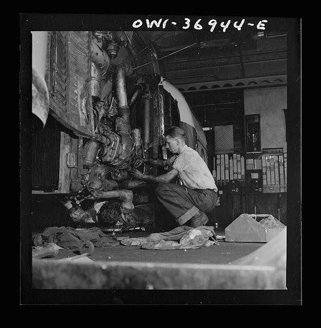 Photo:Aircraft Engine Mechanics 1930s Men Repairing Airplane Engine