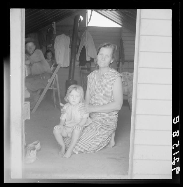 Photo:Tulare County CA 1939 Migrant Mother Child FSA Camp Steel Shelter