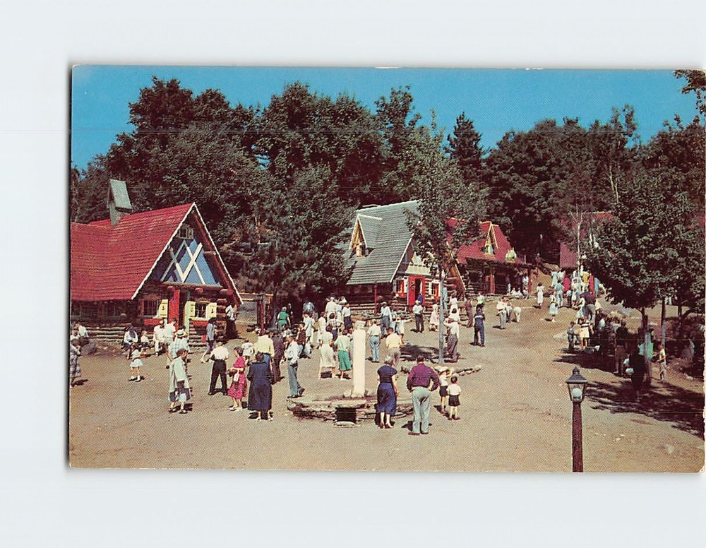 Postcard Santas visitors stroll through his village at North Pole USA