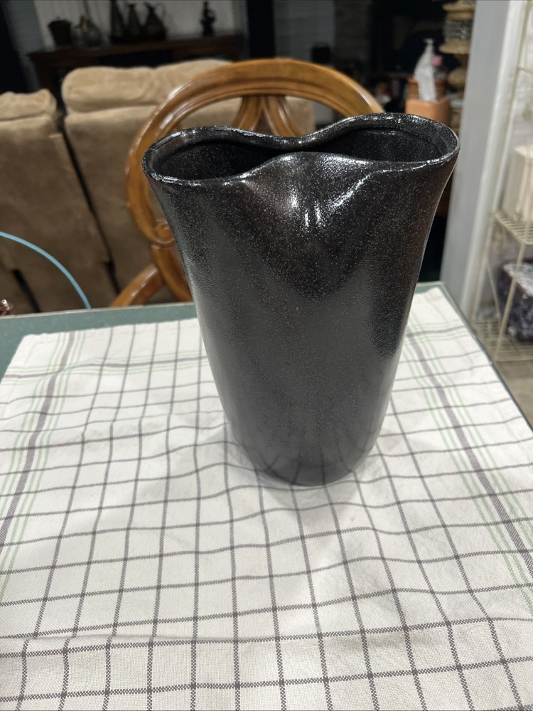Black Ceramic Vase With A Distinctive Wavy Abstract Rim. Beautiful Art Pace-image
