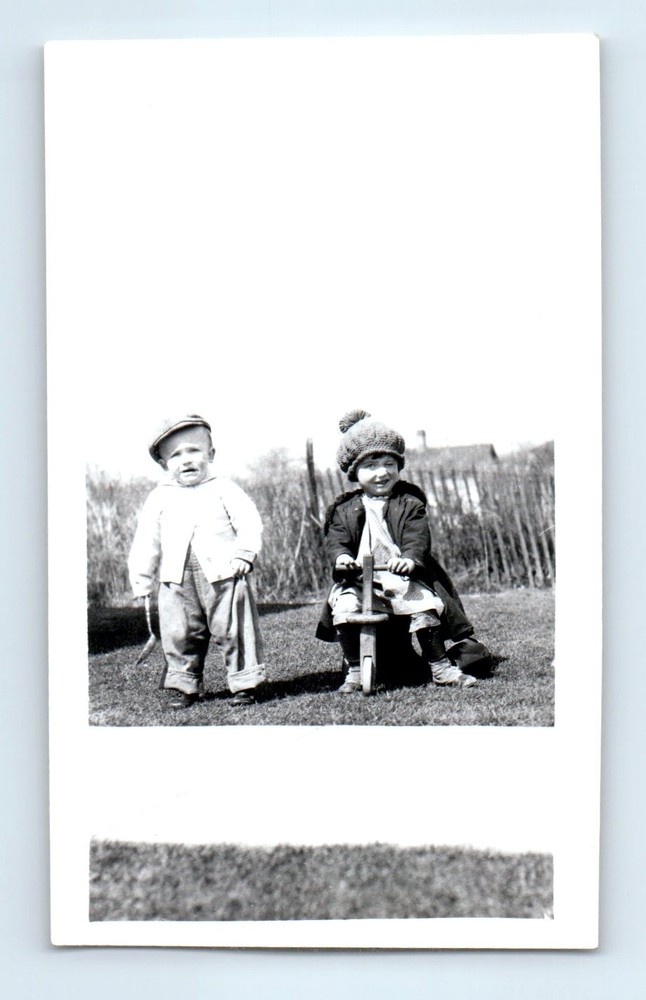 Old Vintage Photo BOY AND GIRL RIDING SCOOTER IN YARD BY SIDEWALK SNAPSHOT
