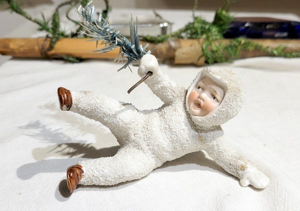 Larger Snow Baby, holding Feather Branch. Early 1900s Miniature German Figure.