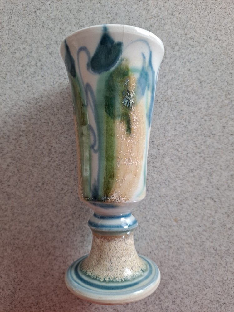 Abstract floral pearlized stoneware pedestal vase in green and blue tones-image