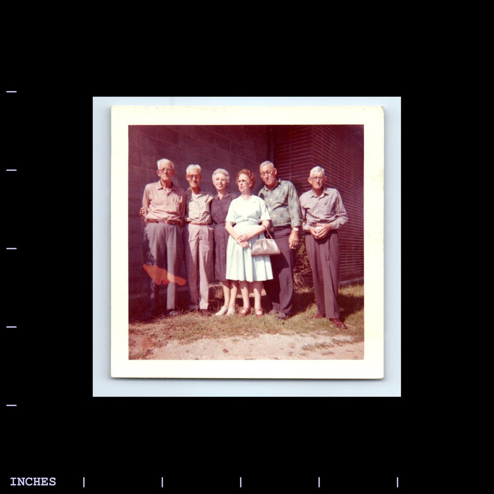 Square Color Photo OLDER MEN AND WOMEN STANDING OUTSIDE