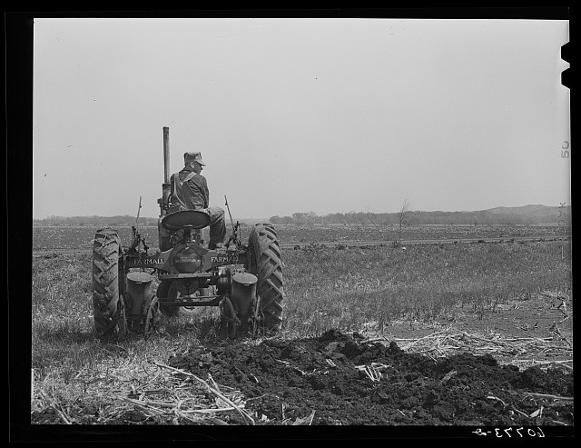 Photo:Monona County Iowa 1940 Farmer Listing and Planting Corn Tractor