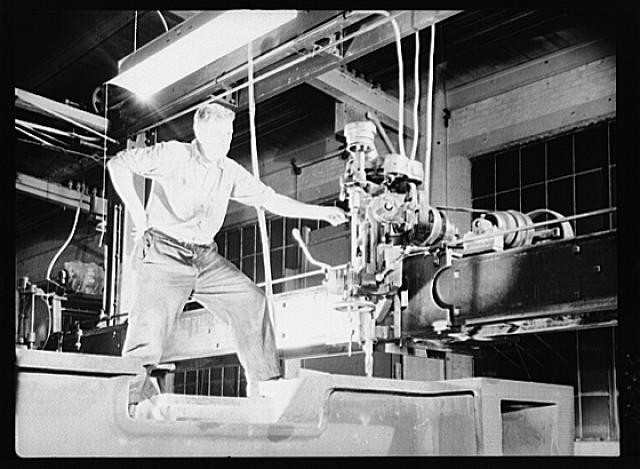 Photo:Industrial Worker Operating Machinery Factory Interior 1930s Photo