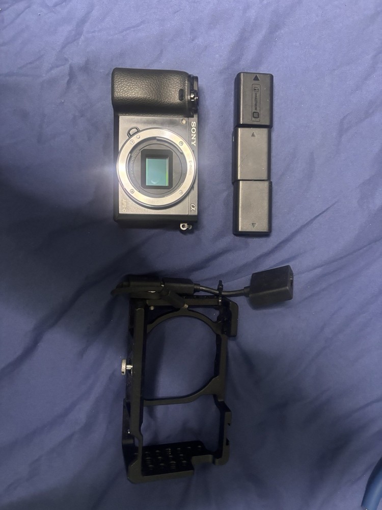 Sony Alpha A6000 Black Small rig and three batteries included*Body Only*