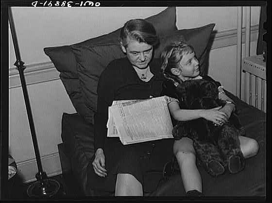 Photo:Mother and Child 1900s Reading on Couch Teddy Bear Interior