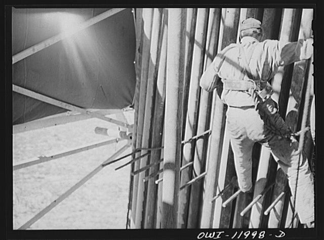 Photo:Andrews County Texas 1930s Derrickman Pulling Drill Pipe Oil Rig
