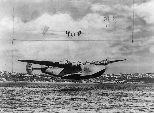 The Famous Boeing 314 Clipper,Airplane flying low over body of water,Seaplane