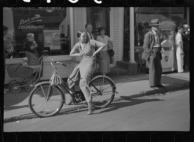 Provincetown Massachusetts 1937 street scene woman bicycle storefront