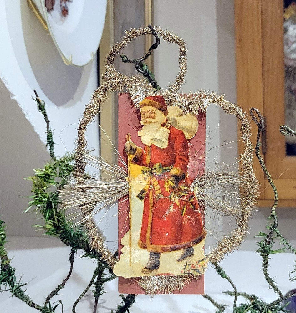 Red Suited Santa, delivering Presents. 1890s Paper & Tinsel German Ornament.