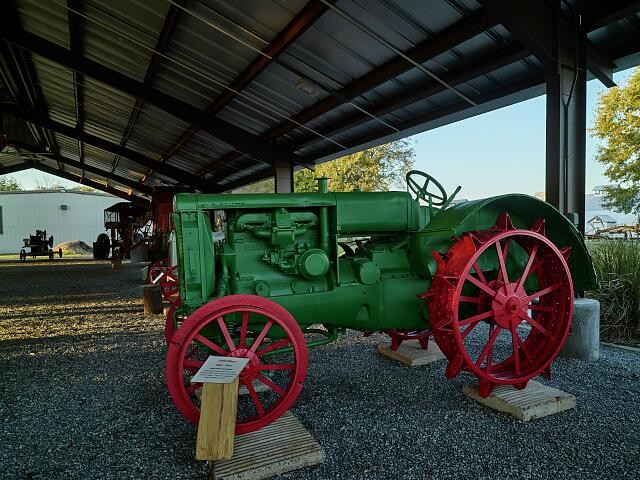 Photo:Vintage harvester Plantation Agriculture Museum, cluster buildings