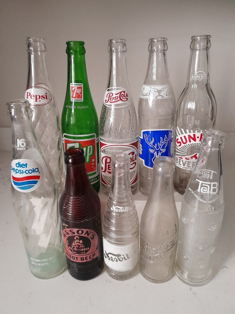 Vintage 10 Pc Soda Pop Bottle Lot Pepsi Dr Pepper 7UP Tab Nesbitts Sun Rise Buck